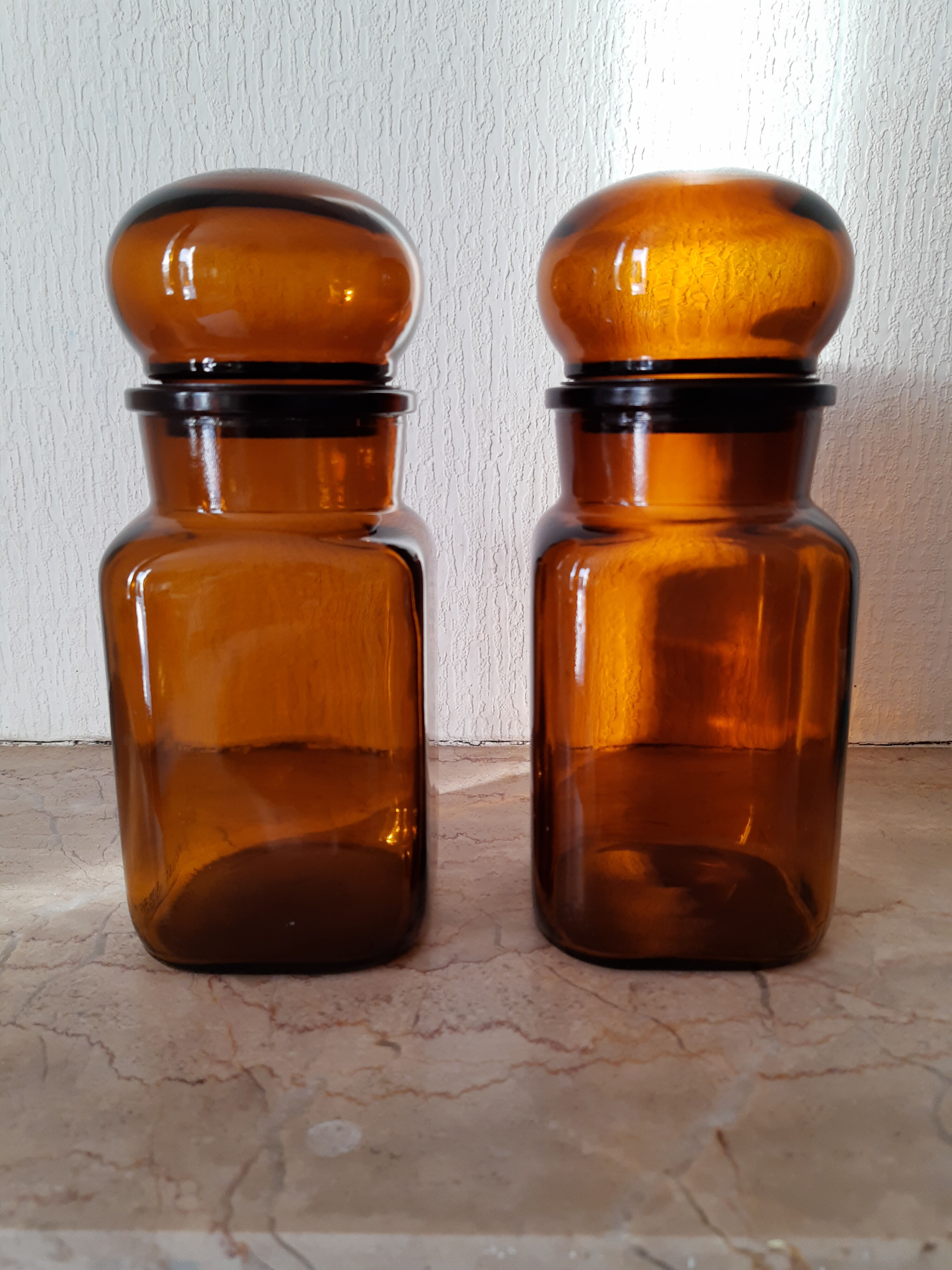 Pair of vintage amber glass jars