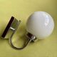Pair of chrome metal wall lights with white glass globe.