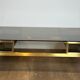 Modernist coffee table in brass and smoked glass tops by Guy Lefèvre for Maison Jansen.