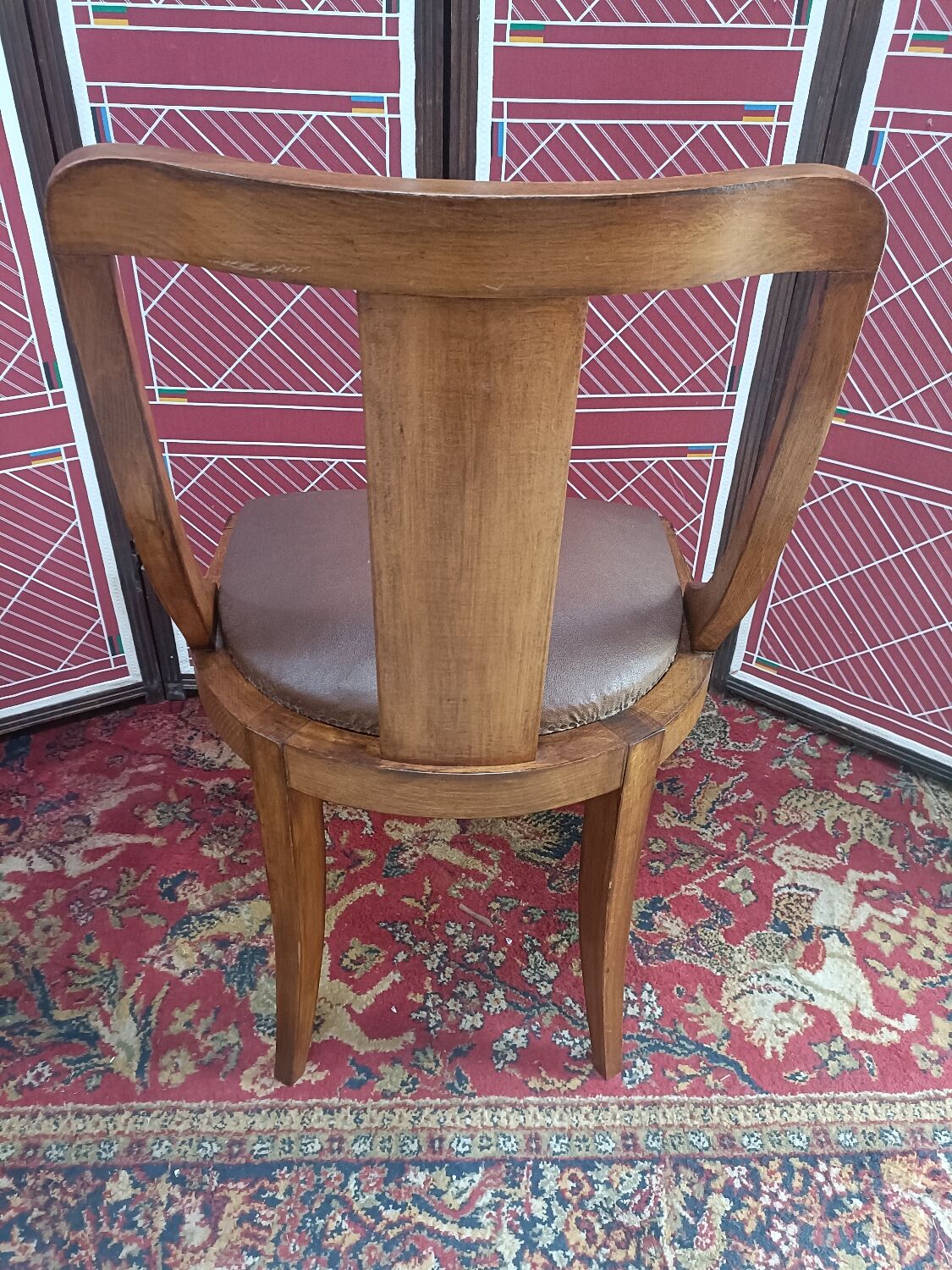 Gondola chair with art-deco motifs, spring leatherette seat