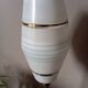 Mid-century gold metal table lamp with white striped shade