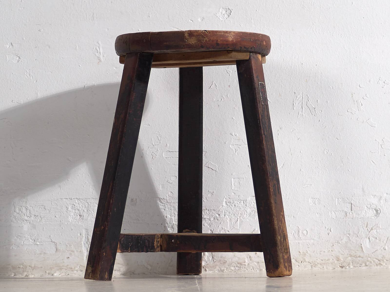 Antique round dark colored stool (c.1900)