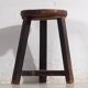 Antique round dark colored stool (c.1900)