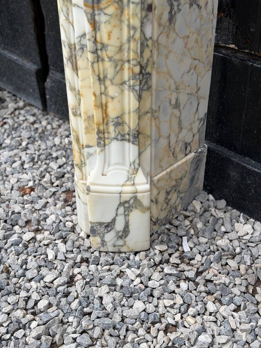 Louis XV style fireplace in purple breccia marble, circa 1880.