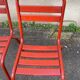 2 red metal Tolix-style chairs, France 1950