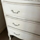 Chest of drawers with 3 curved legs