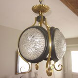 Suspension of years 50-60 in glass and metal