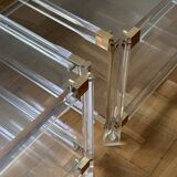 2 side tables in plexiglass, glass, and brass.