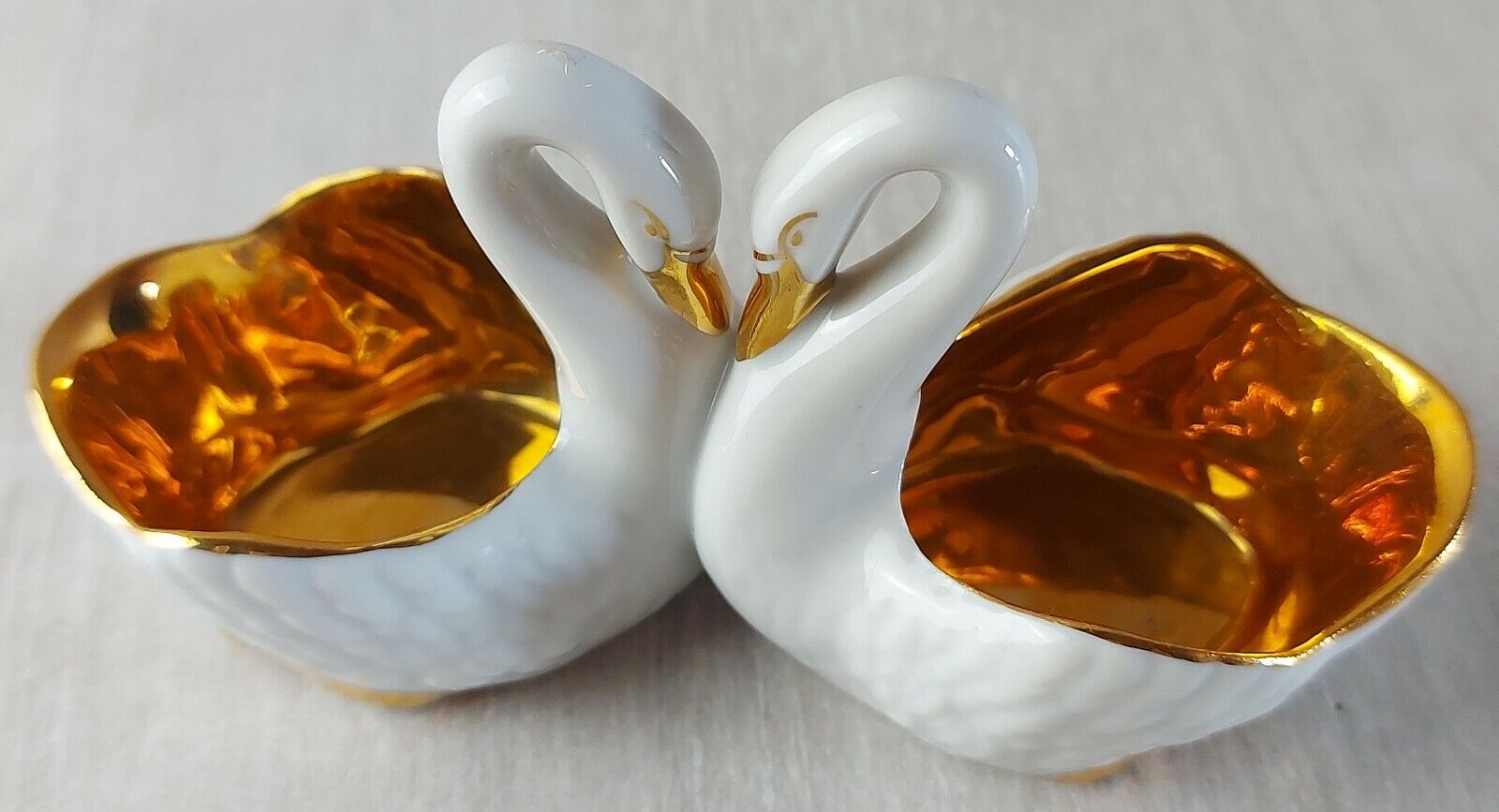 Old porcelain saleron, swan shape, gilded decoration, France porcelain