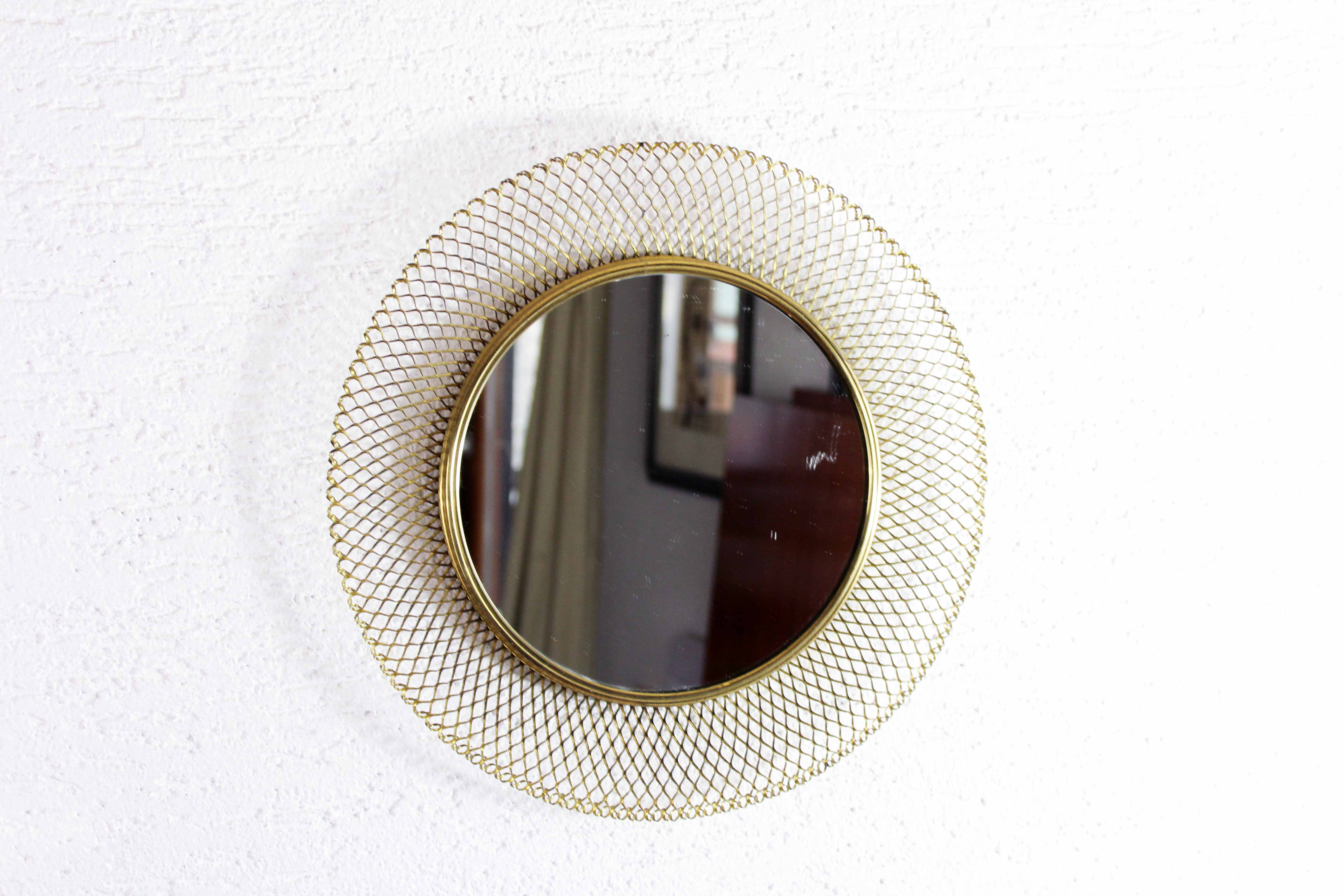 Vintage round mirror in gilded metal