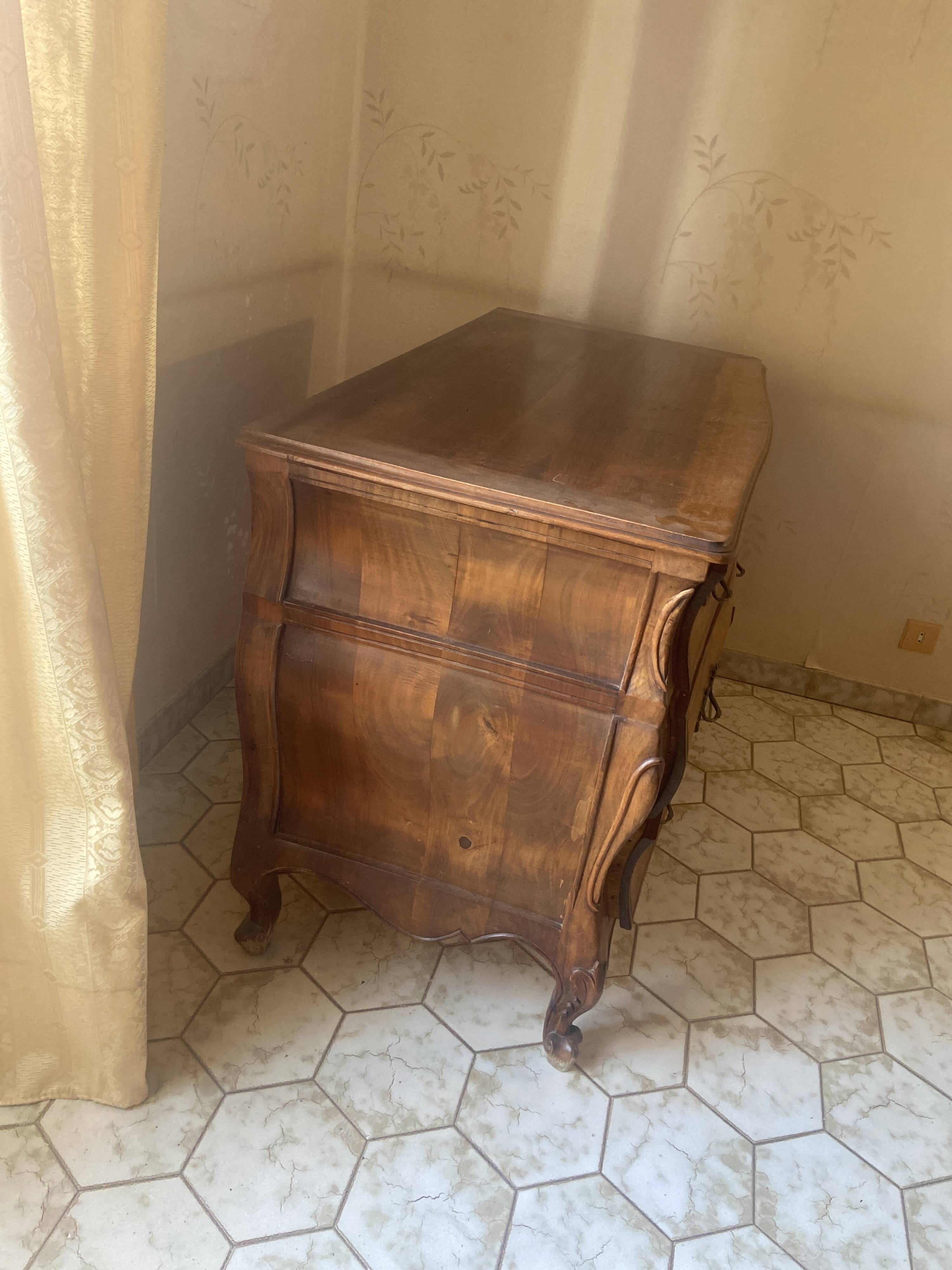 Curved commode with three drawers in light wood, Louis XV style.