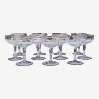 Set of 11 carved glass champagne glasses