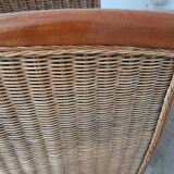 Armchair in woven rattan and exotic wood