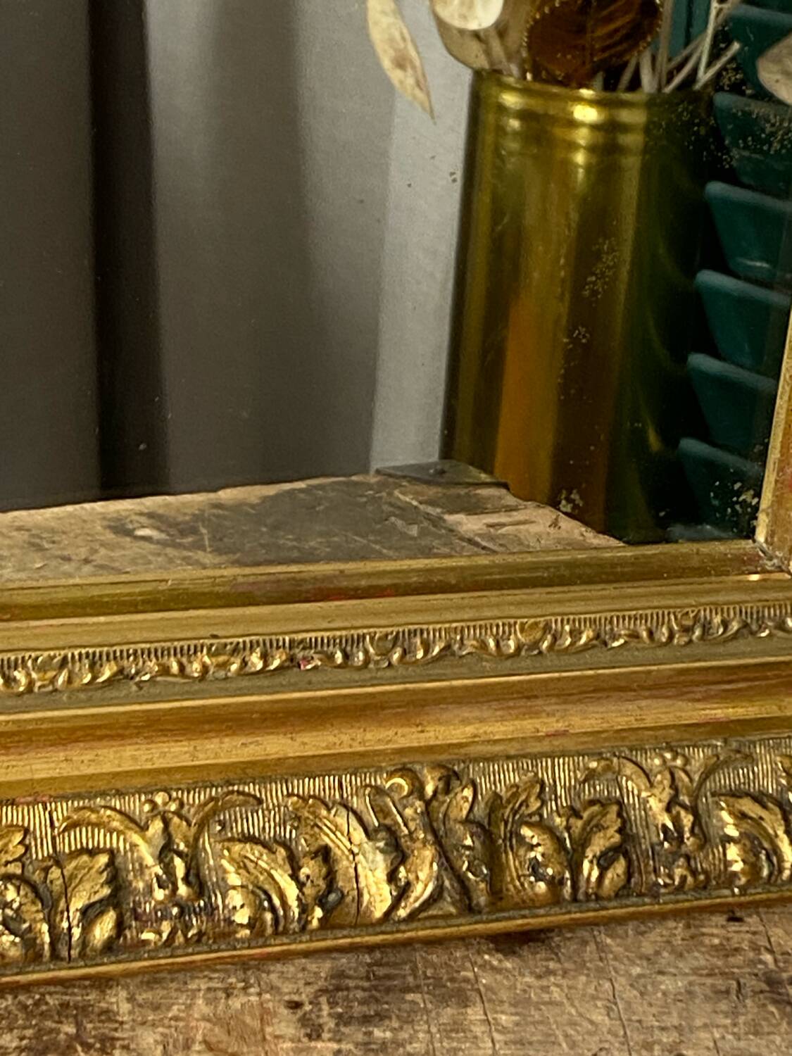 Antique mirror in carved gilded wood