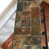 Iron and stone brutalist magazine rack