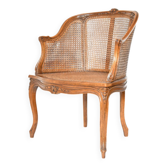 Fauteuil bergère canné de style Louis XV