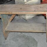 Small brown country bench in solid pine, from the period 1890-1919, rustic style.