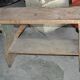 Small brown country bench in solid pine, from the period 1890-1919, rustic style.