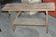 Small brown country bench in solid pine, from the period 1890-1919, rustic style.