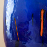 Blue blown glass vase and orange inclusion
