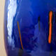 Blue blown glass vase and orange inclusion