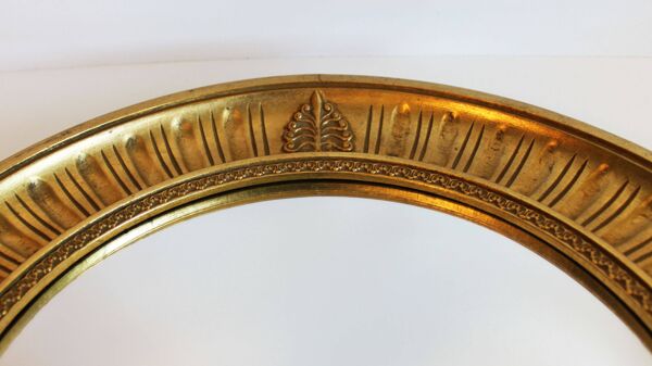 Miroir soleil en bois sculpté doré, style Empire, 60’s.