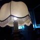 Turned wood table lamp with “skin” shade