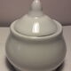 Set of 4 small covered pots in white porcelain