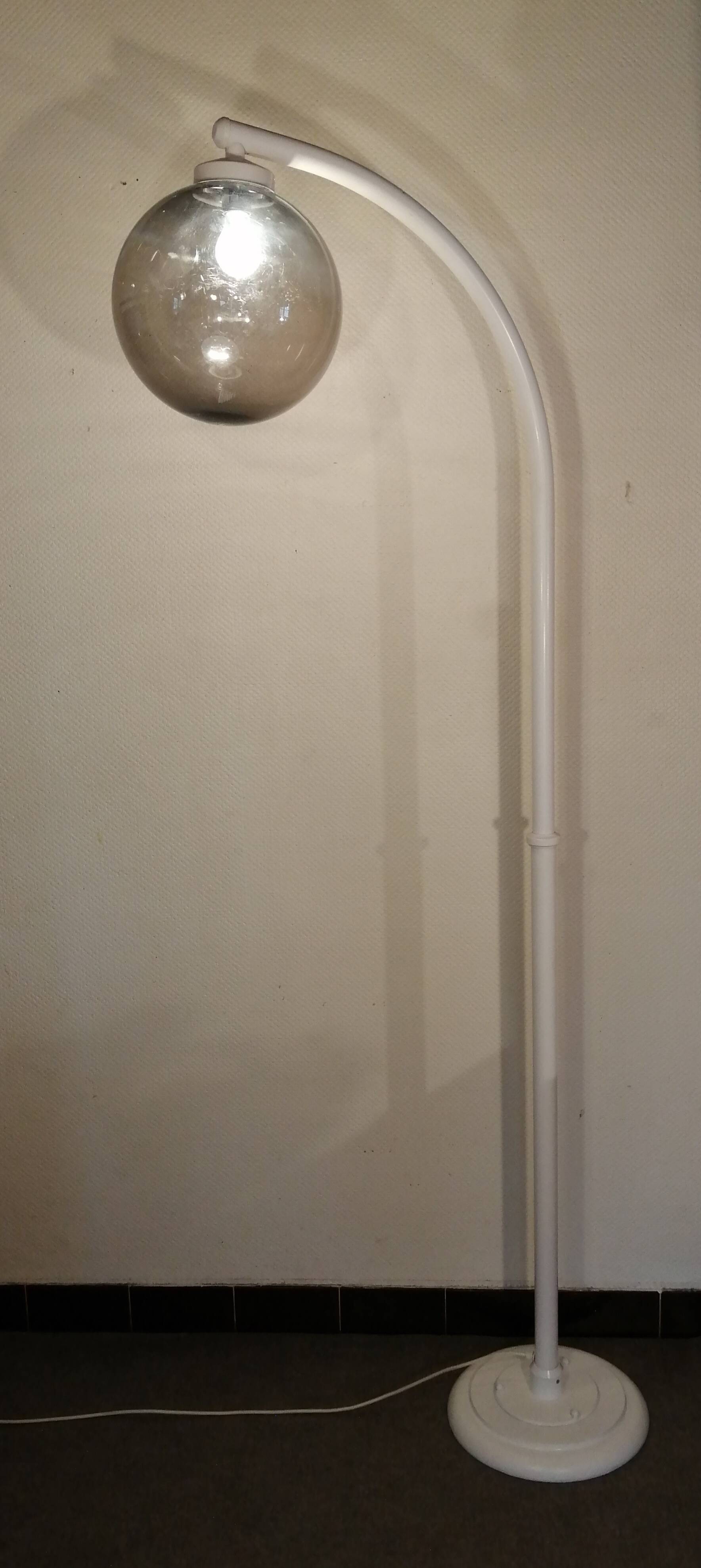 Adjustable metal floor lamp with its vintage smoked ball model from Roger Pradier 1970
