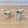 DUO OF CERAMIC AND WOOD CANDLEHOLDERS IN SCANDINAVIAN DESIGN.