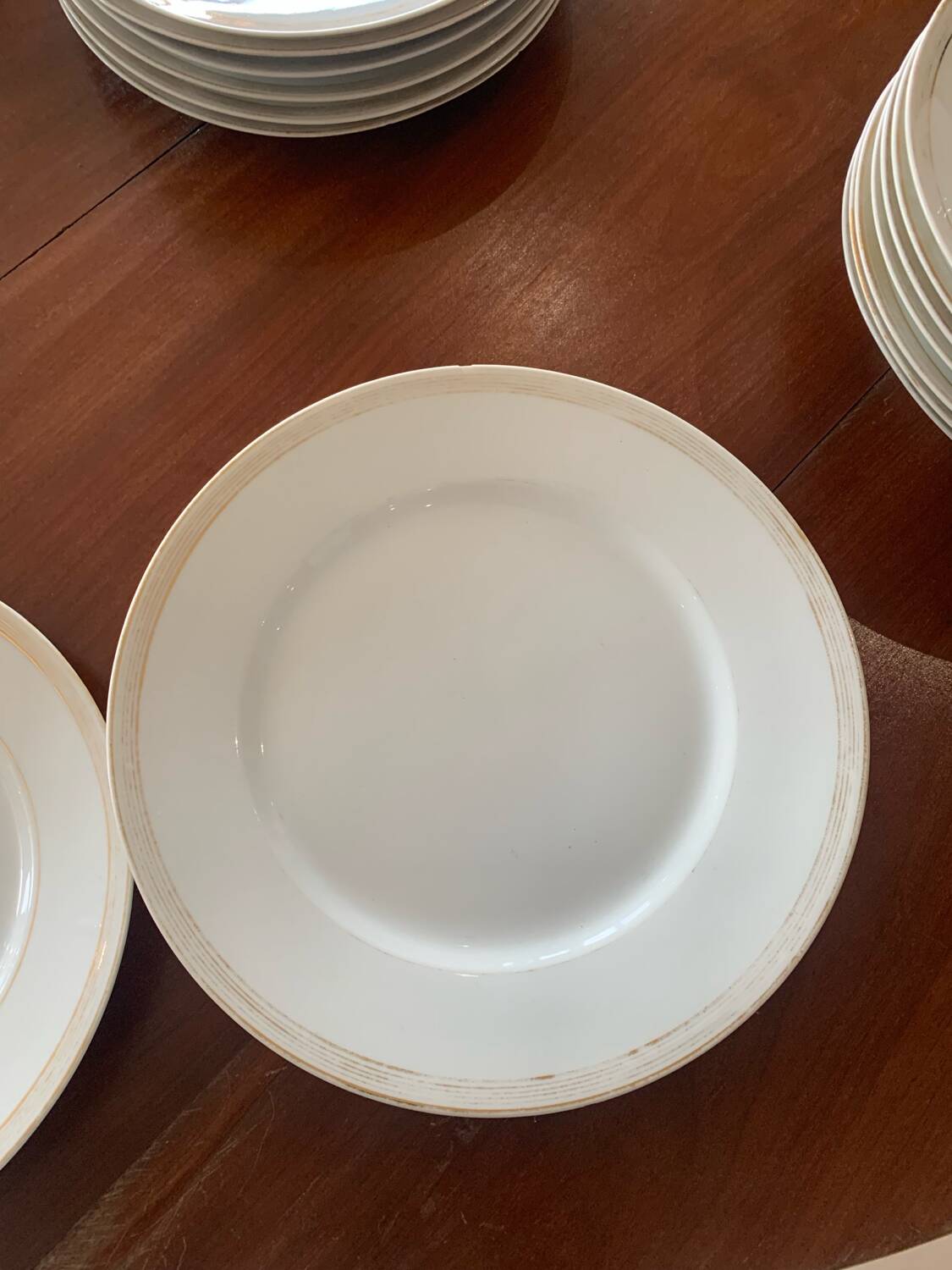 Lot of six flat plates, crockery, old white, gilded