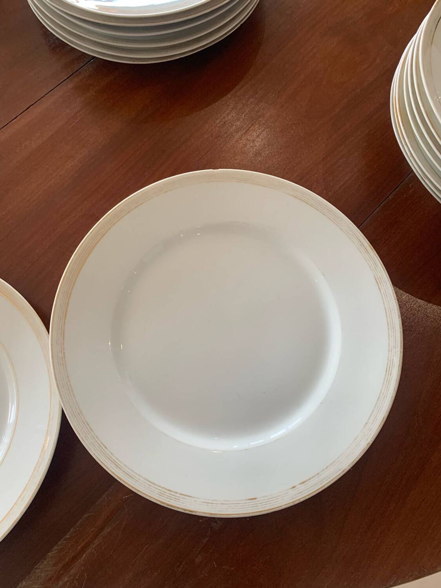 Lot of six flat plates, crockery, old white, gilded