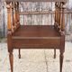 Solid wood bedside table with turned columns, early 20th century.