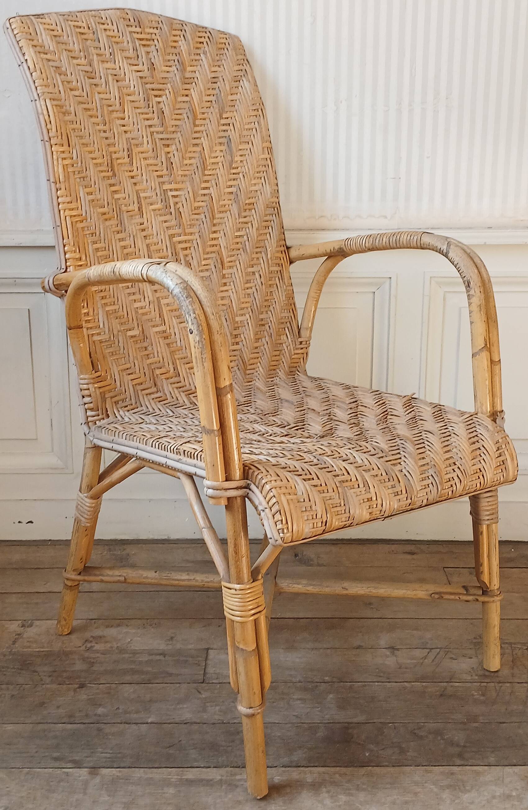 High-backed adult rattan armchair, circa 1960