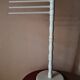 Bath towel rack in white wood, three bars.
