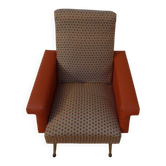 Vintage rockabilly retro armchair in orange faux leather and fabric.