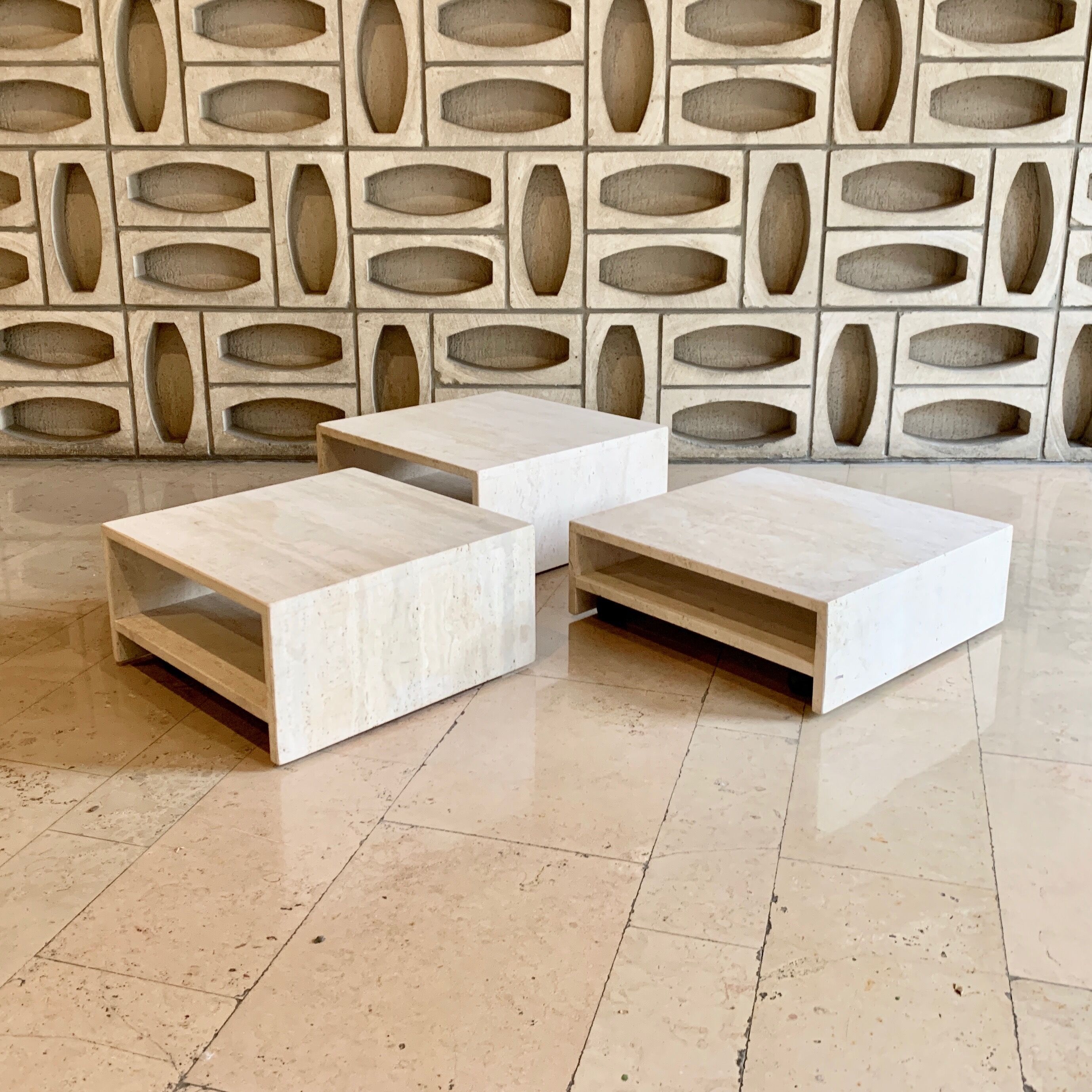 Modular square coffee tables in softened travertine
