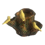 Old slipware birds on a tree trunk