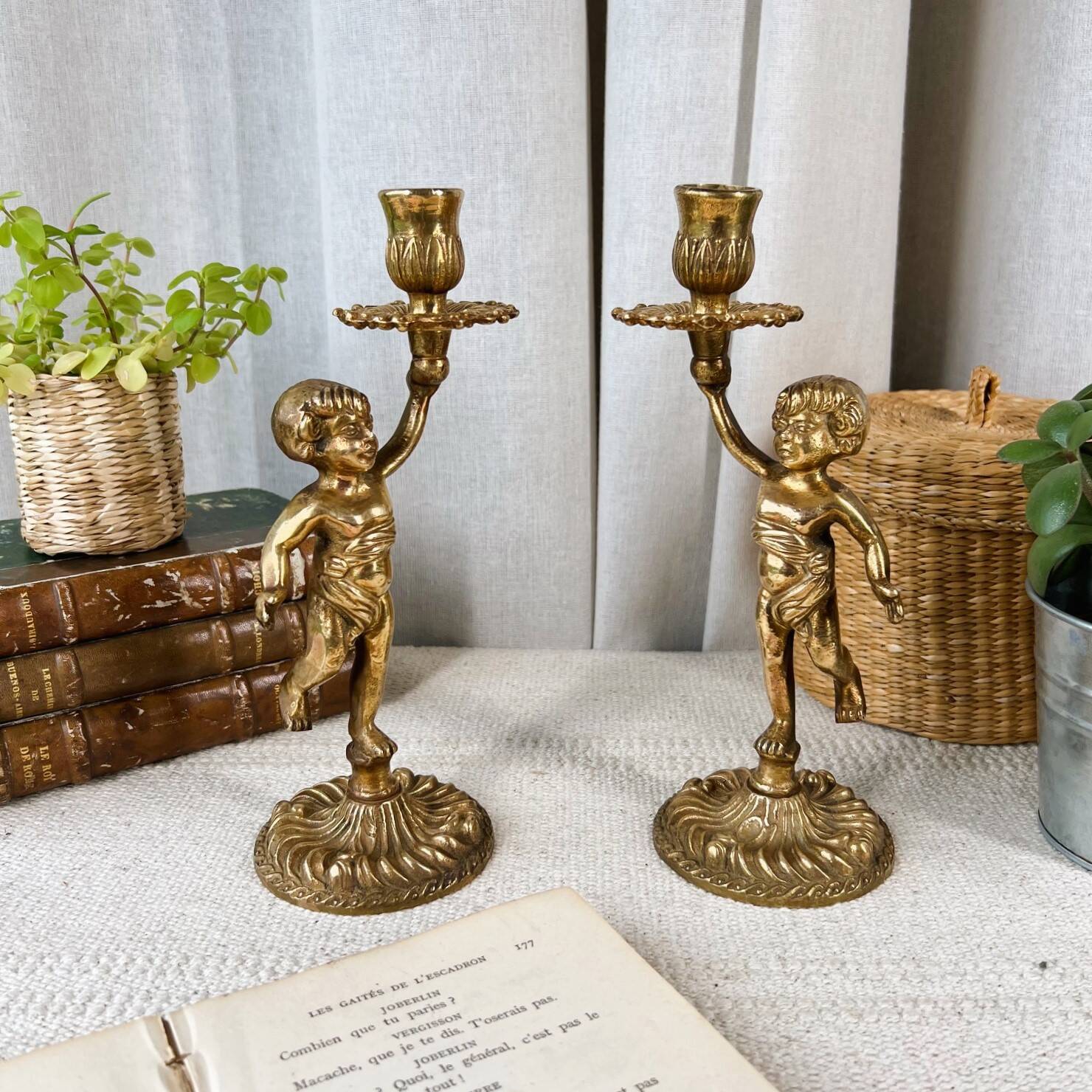 Pair of bronze “Cherubim” candlesticks