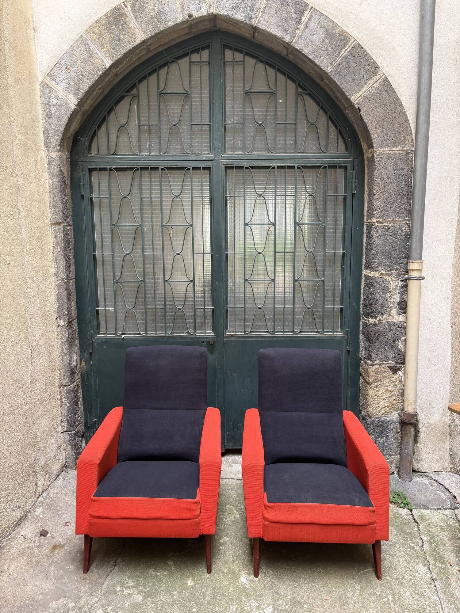 Pair of vintage black and red armchairs from the 1960s.