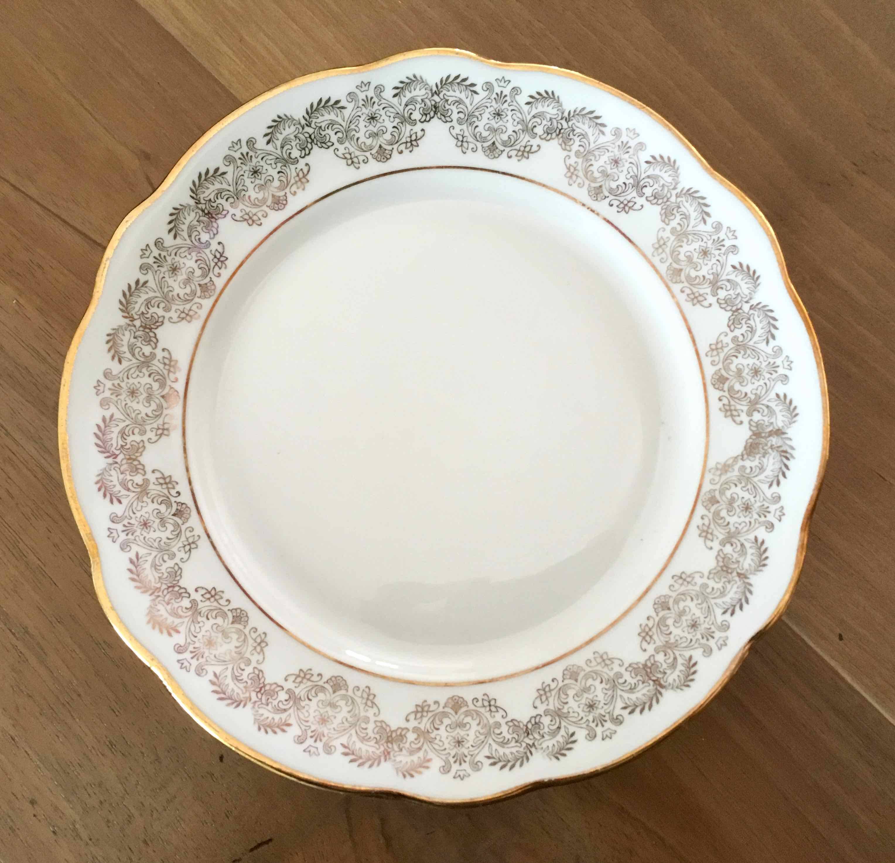 8 white and gold porcelain dessert plates