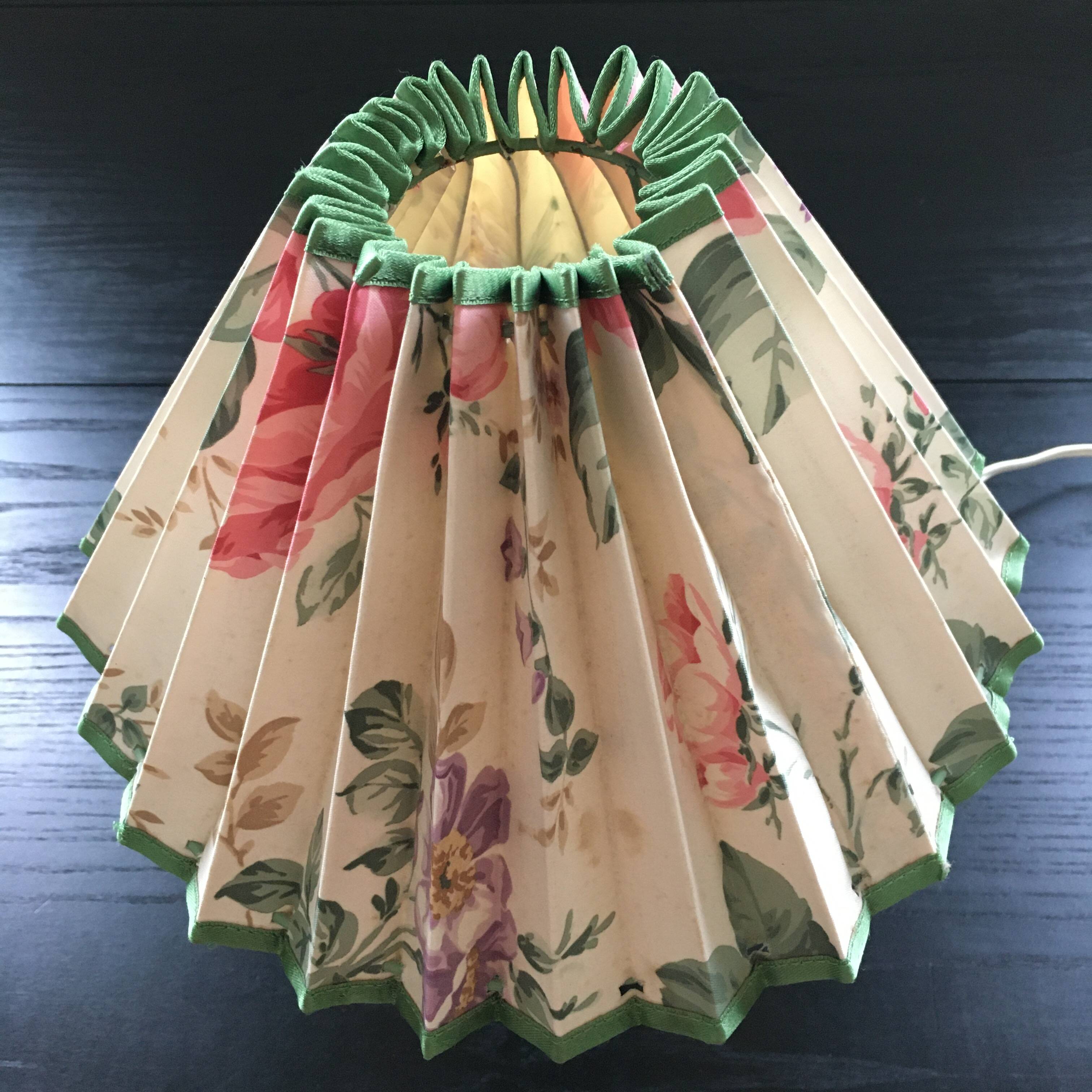 Green ceramic lamp and flowered lampshade