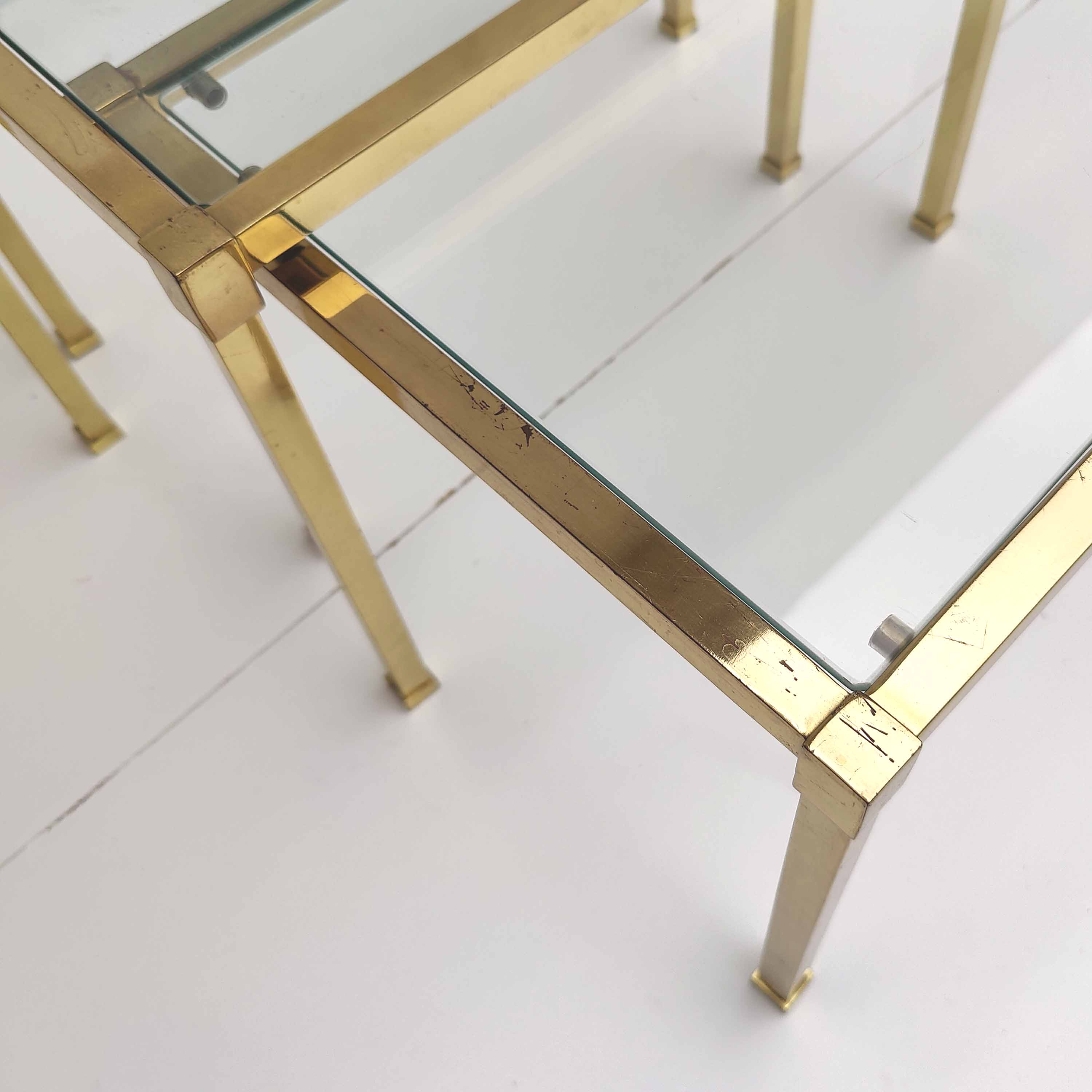 Brass and glass trundle tables