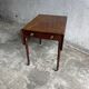 Antique drop-leaf side table on wheels