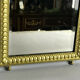 Old gilded bronze mirror in Louis XVI style with beveled mirror 37x23,5cm