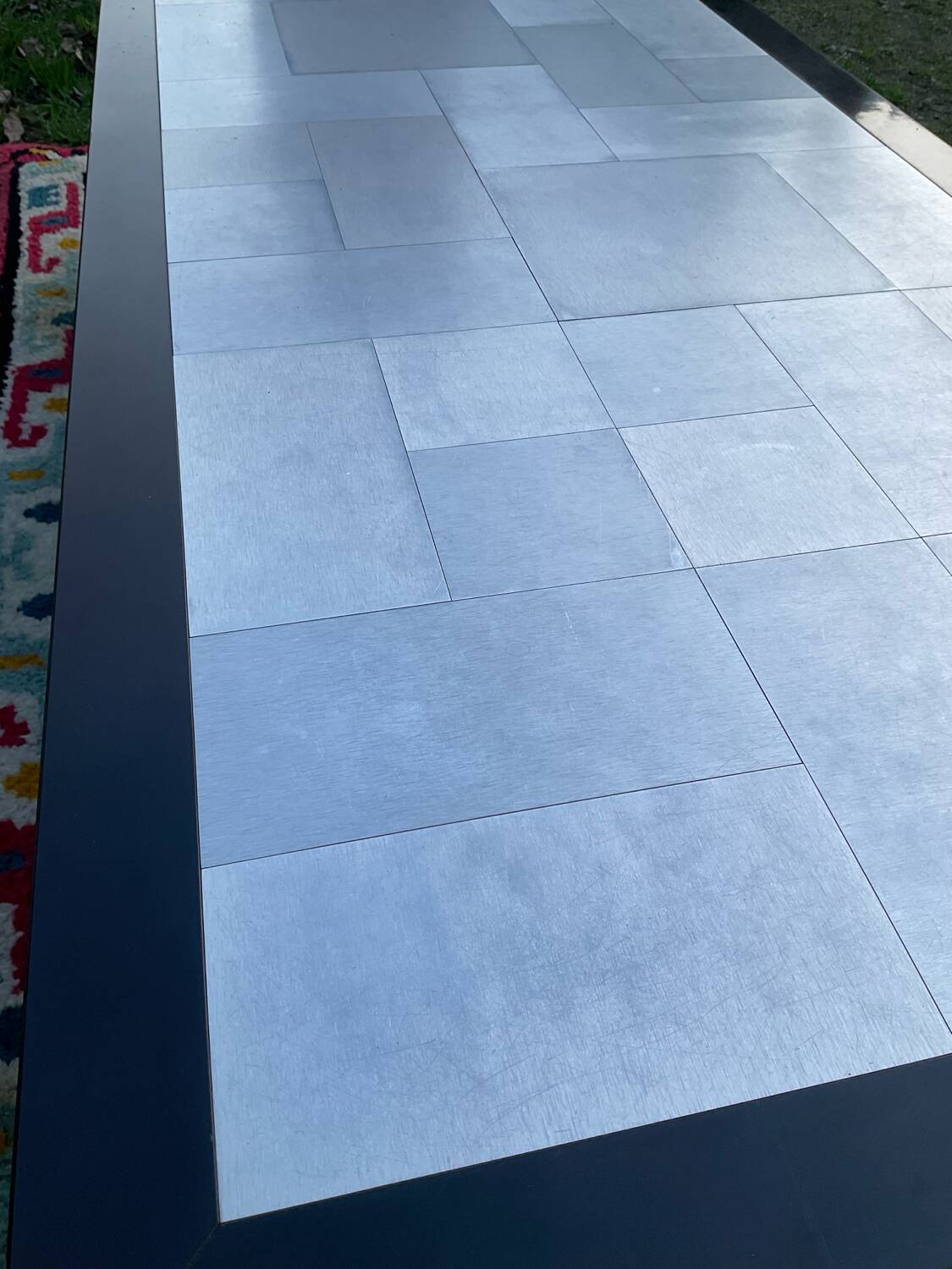 Vintage coffee table in stainless steel and black lacquered wood.