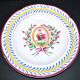 Saint-Clément earthenware rooster plate with floral medallion and ribbon decoration
