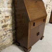 Oak display secretary cabinet with drop-down front, two sections.