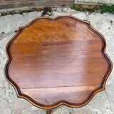 Small wooden pedestal table