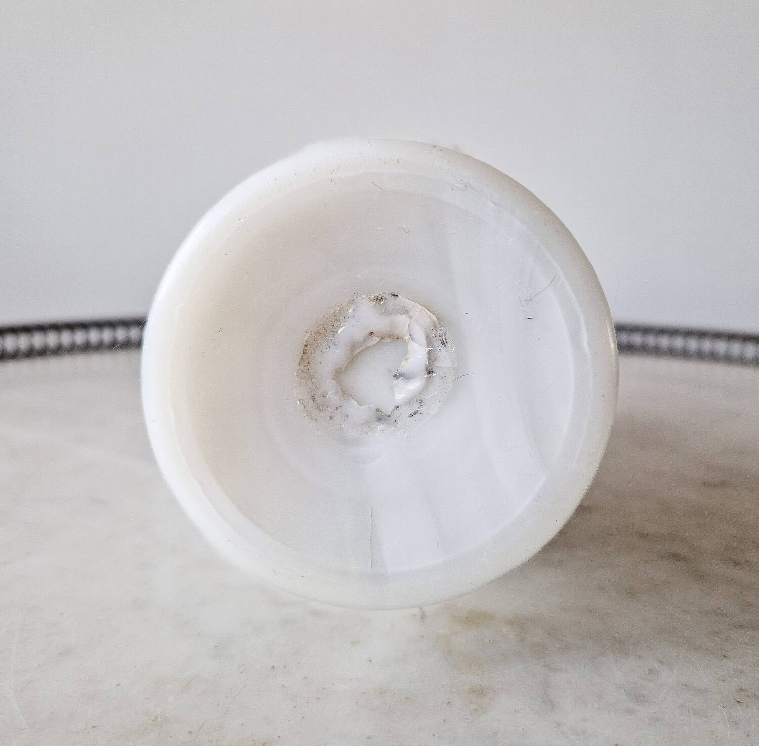 White opaline vase decorated with arabesques and ram's heads